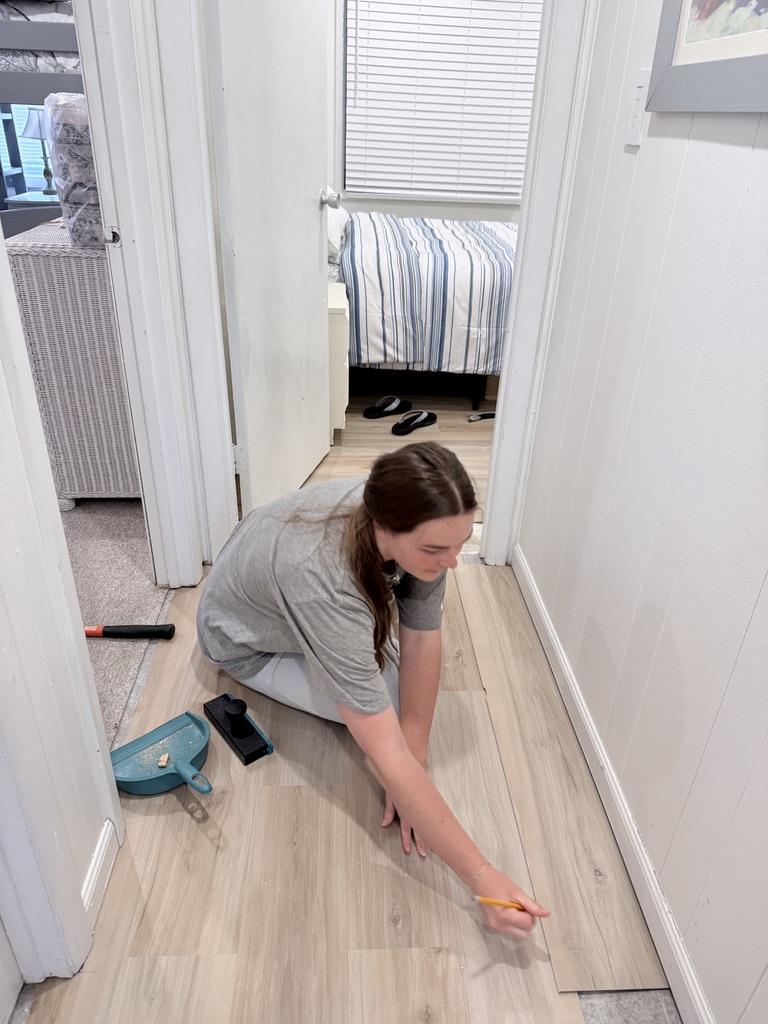 Installing flooring in the Lea hallway